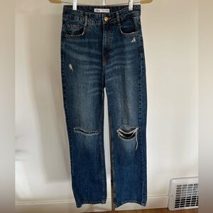 Wide leg jeans with cut outs at the knee
